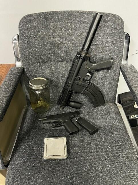 Firearms and drugs that were seized in the arrest.