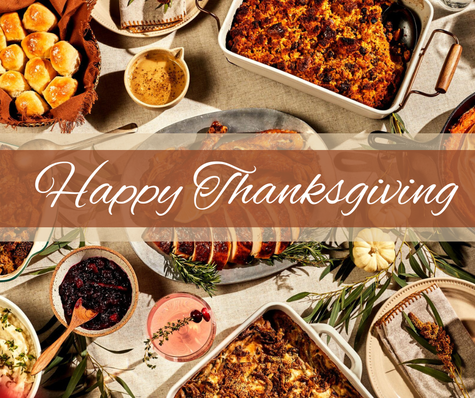 Happy Thanksgiving - A variety of traditional Thanksgiving foods on a table.